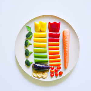 A plate of colorful fruits and vegetables, arranged in a rainbow pattern.