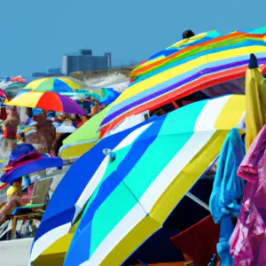 A vibrant beach scene with a colorful array of beach towels and umbrellas.