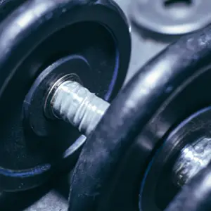 A close-up of a barbell with weights on it.