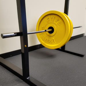 A barbell resting on a bright yellow weightlifting platform.
