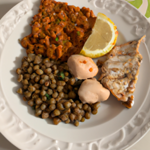 A plate of food with various protein sources such as chicken, fish, and lentils.