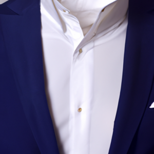 Suggestion: A close-up of a white dress shirt with a navy blue blazer draped over it.